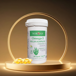 Veganska Omega 3 iz alg – škatlica z raztresenimi kapsulami prehranskega dopolnila EPA in DHA.