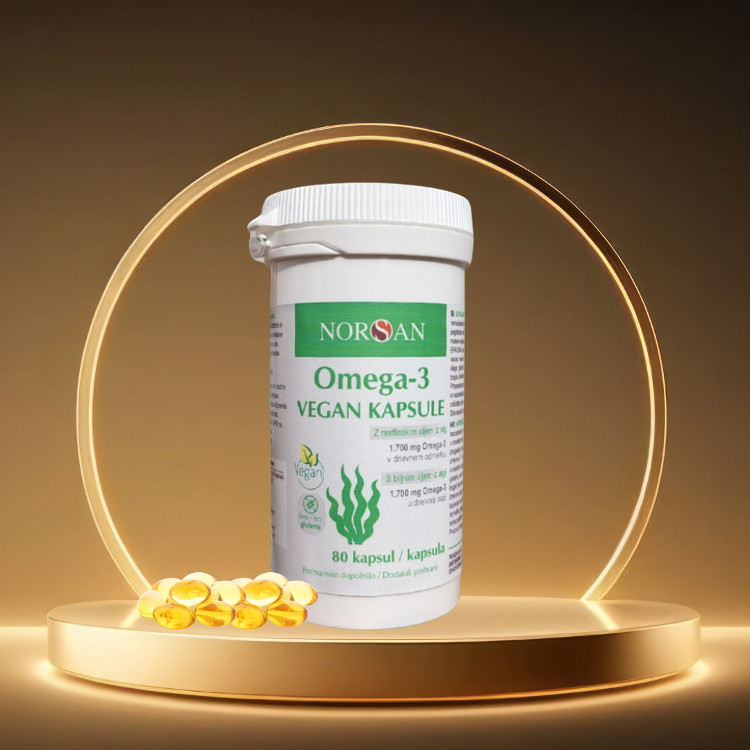 Veganska Omega 3 iz alg – škatlica z raztresenimi kapsulami prehranskega dopolnila EPA in DHA.